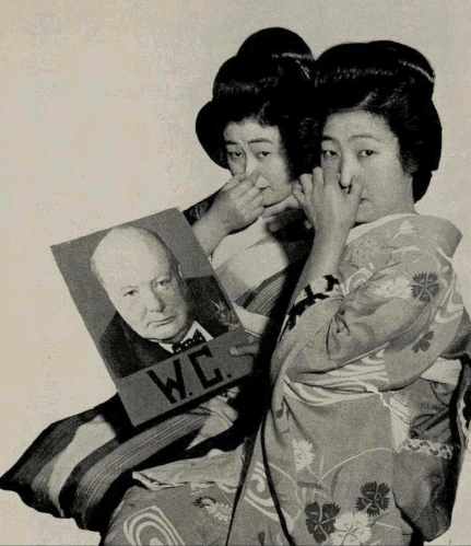 Two Japanese women grimacing at Winston Churchill